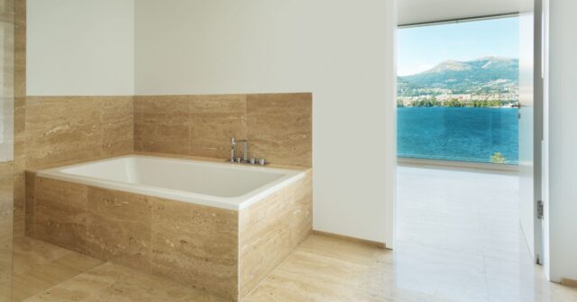 Natural stone flooring of a luxurious bathroom.