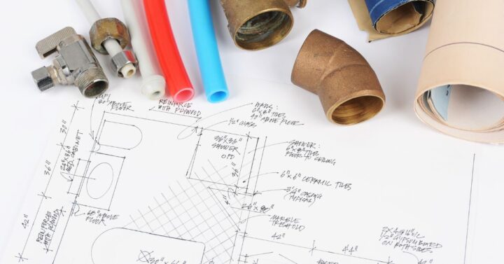 A bathroom renovation plan and plumbing materials.