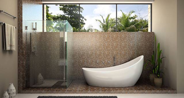 Beautiful bathroom with white bathtub and glass shower.