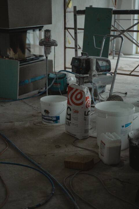 Construction materials and equipment in a building floor.