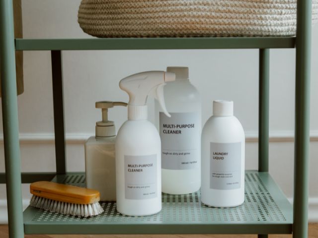 Home made natural cleaning products in steel shelve.
