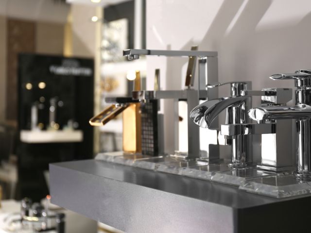 New & shiny faucets displayed on a store.