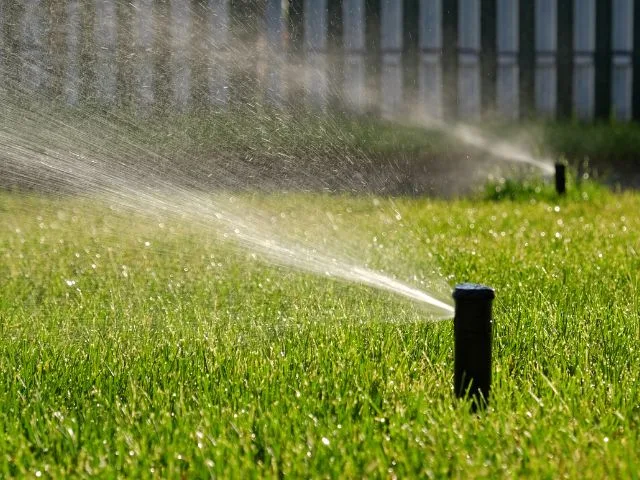 Automatc garden sprinkler using recycled water from bathroom.