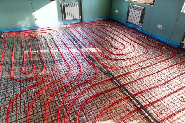 Installation of floor heat insulation.