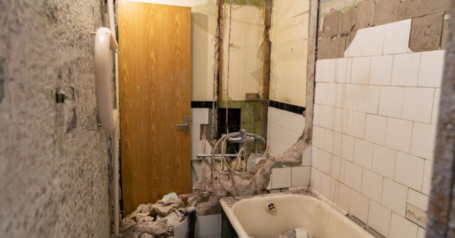 Demolition of an old bathroom before renovation.