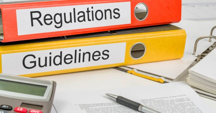 Pile od documents about regulations on renovationg a house.