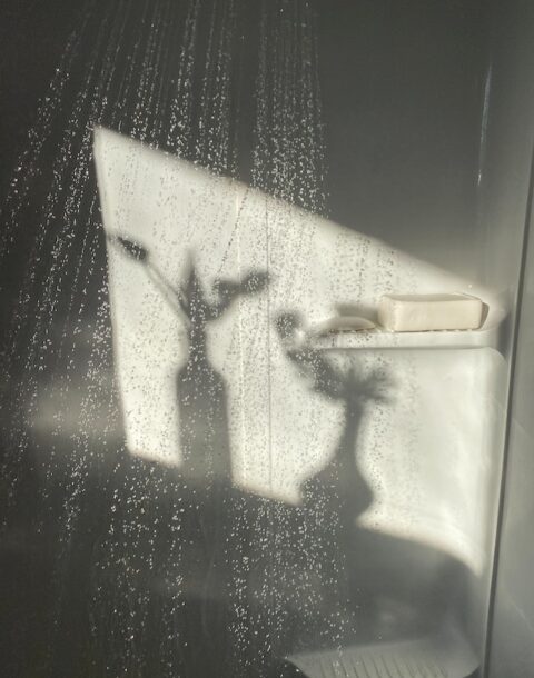 A running shower in bathroom.