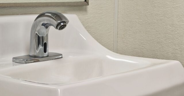 Touchless faucet in a smart bathroom.