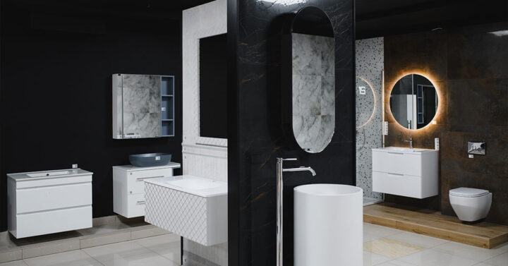 Showroom display of various modern bathroom vanities, sinks, mirrors, and fixtures in contrasting styles and finishes.