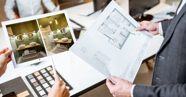 Designer showing client some options for their bathroom makeover.