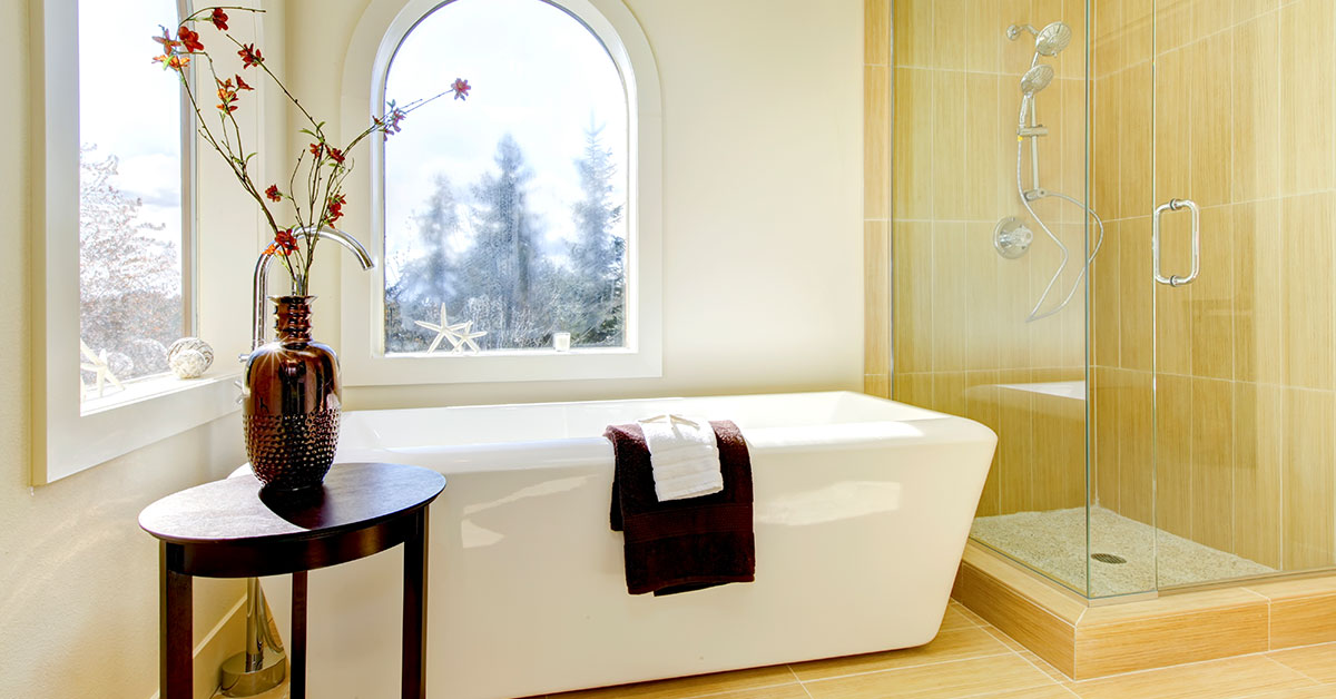 Traditional styled bathroom with bathtub and shower.