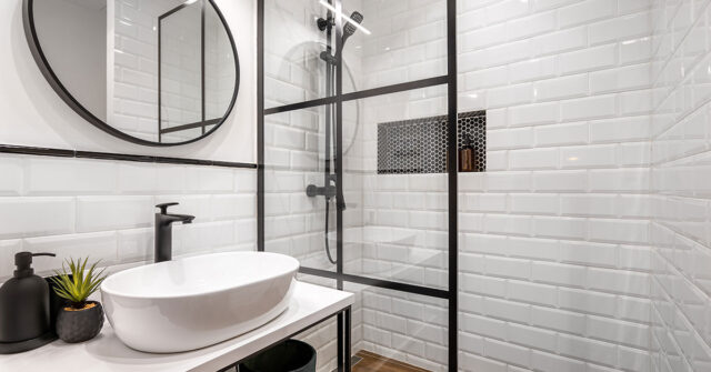Freshly renovated bathroom with white tiled walls and rustic industrial finishes