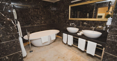 Large stylish ensuite withfree standing bathtub and dual sinks