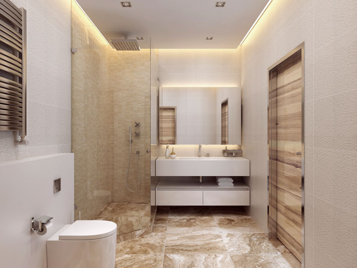 Elegant bathroom with a walk-in glass shower, floating vanity, modern toilet, and warm beige and stone textures throughout.