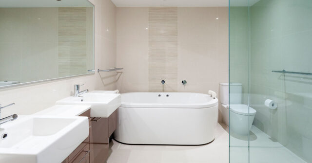 Modern bathroom with all the desireable features including shower, bath, double sink and large mirror