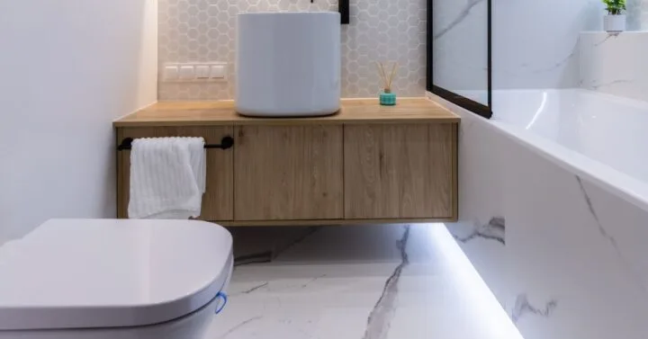 Shot of toilet, floating vanity and bath / shower combo maximising the space of a small bathroom