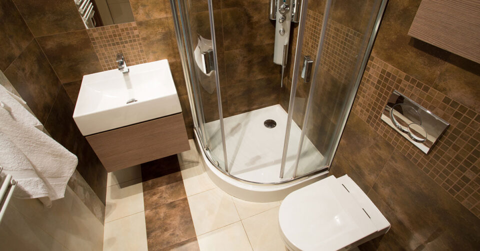 Small ensuite with sink, vanity, shower and toilet.