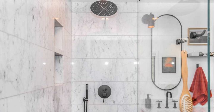 Modern shower on a white marble bathroom.